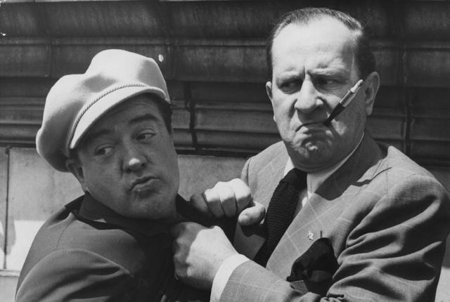 1950: American comedy duo Bud Abbott (1895 - 1974) and Lou Costello (1906 - 1959) who starred in over 35 films together, during a visit to England. (Photo by Central Press/Getty Images)